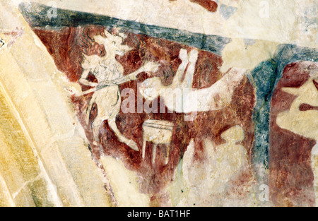 Mittelalterliche Wandmalerei Broughton Cambridgeshire The Devil quälende Seelen Hell rot Ocker bemalen biblische Bilder Englisch Stockfoto