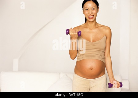 Schwangere Frau auszuüben. Stockfoto