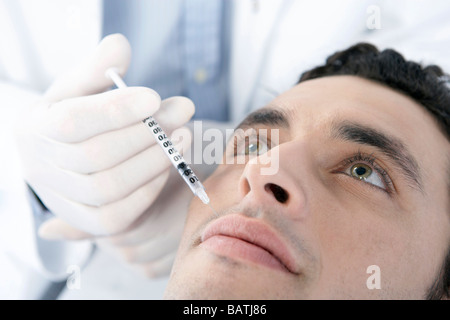 Botox-Behandlung. Patienten mit Botox ins Gesicht gespritzt. Botox ist ein Eurotoxin für kosmetische Zwecke verwendet. Stockfoto