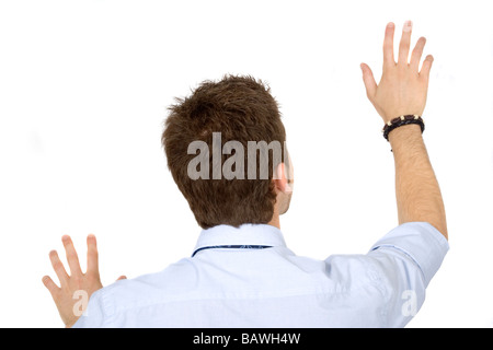 Business-Mann berühren oder etwas hinter ihm zu bewegen Stockfoto