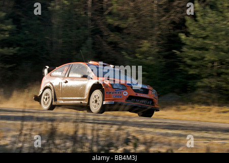 Henning Solberg und Beifahrer Cato Menkerudcompete 2009 der Wales Rally GB Stockfoto