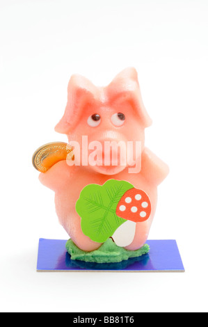 Marzipan-Schwein mit einem vierblättrigen Kleeblatt Stockfoto