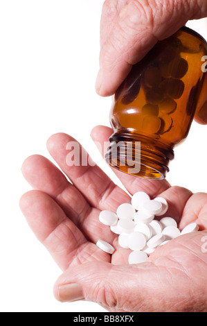 Leitenden Händen mit Haufen von Tabletten Stockfoto