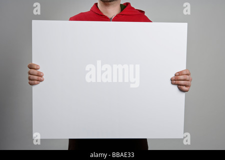 Ein Mann mit einem leeren Schild Stockfoto
