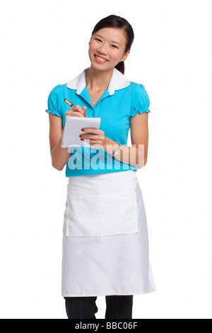 Kellnerin lächelnd in die Kamera, Bestellung Stockfoto
