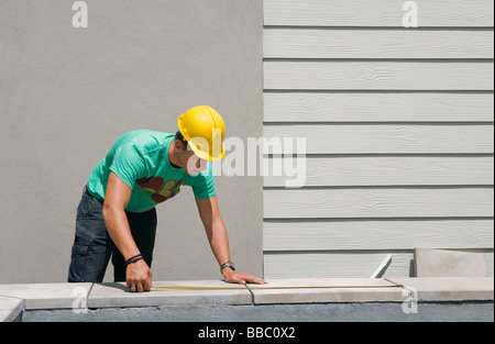 Mann Maßnehmen Stockfoto