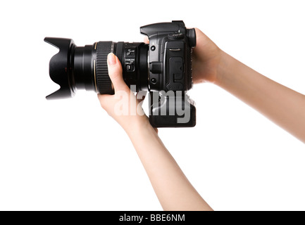 Frau Hände halten professionelle Foto-Kamera isoliert auf weiß Stockfoto