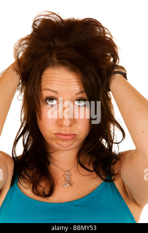 Junge Frau reißt ihr Haar, keine Ahnung Stockfoto