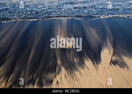 Kohlenstaub am Strand von Newbiggin-by-the-Sea in Northumberland. Stockfoto