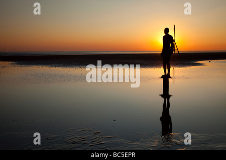 Sir Antony Gormley artwork Eine andere Stelle Crosby Strand, die Teil der Sefton Coast befindet, innerhalb der Liverpool City Region des Vereinigten Königreichs. Stockfoto