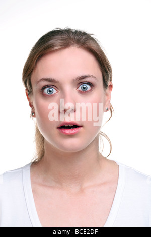 A woman with a shocked expression on her face isolated on a white background Stockfoto