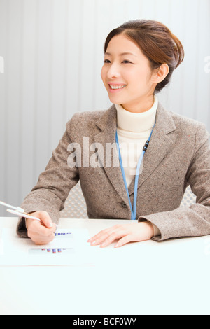 Portrait of young woman in office Stockfoto