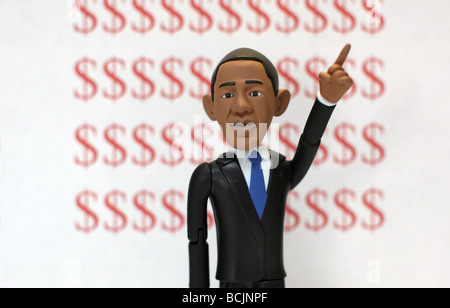 Barack Obama Actionfigur mit Dollar-Zeichen Stockfoto