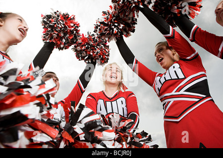 Cheerleader mit Pompons Stockfoto