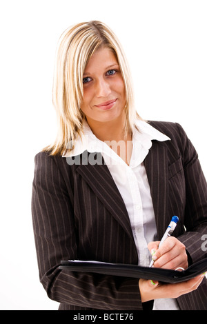 Junge Frau trägt einen Anzug hält einen Terminkalender Stockfoto