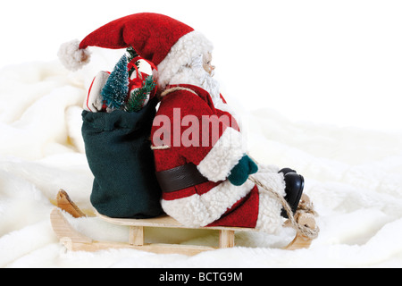 Weihnachtsmann auf Schlitten, Deko Figur Stockfoto