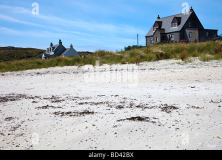 Häuser an einem Sandstrand auf den Inneren Hebriden-Insel Iona, Argyll, Schottland Stockfoto