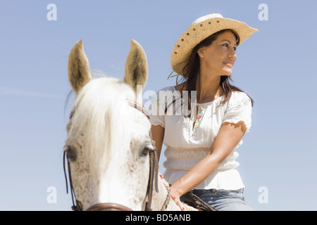 Eine Frau auf einem Pferd Stockfoto