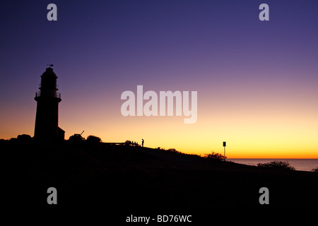 Malerischen Sonnenuntergang mit der Silhouette des Vlaming Head Lighthouse. Exmouth. Cape Range National Park. Western Australia, Australia Stockfoto