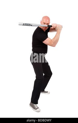 Leitung Glatzkopf mit Baseballschläger vor seinem Gesicht schaut wütend in die Kamera Stockfoto