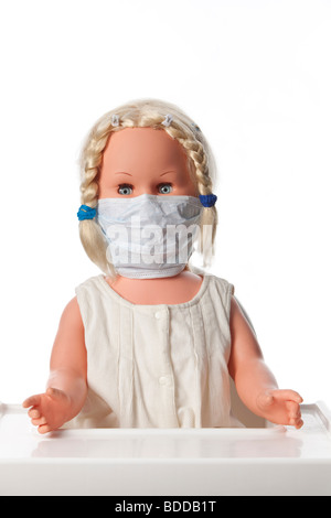 Eine Puppe mit einer Mundmaske zur Vorbeugung von influenza Stockfoto