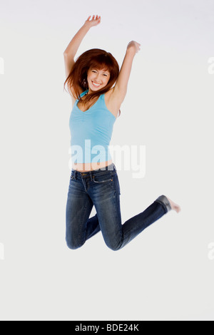 Happy woman jumping. Stockfoto