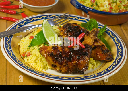 Piri Piri Hähnchen essen Stockfoto