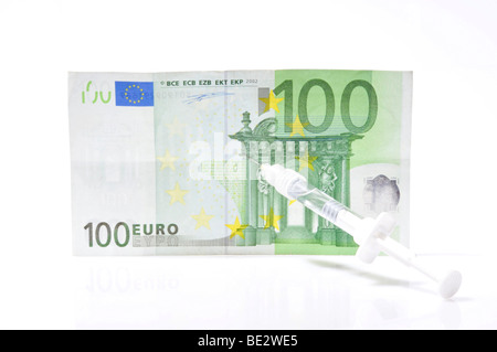 Spritze und Banknoten Stockfoto