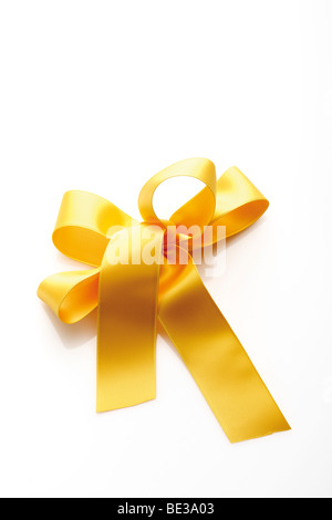 Gold Gelb Geschenkband in einem Bogen Stockfoto