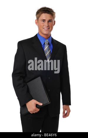 Junger Geschäftsmann hält einen Ordner auf einem weißen Hintergrund isoliert Stockfoto