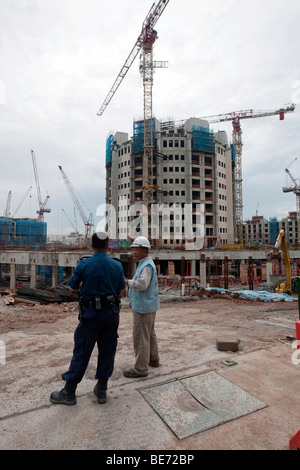 Bauarbeiter auf einer Baustelle Bauboom in Singapur, Asien Stockfoto