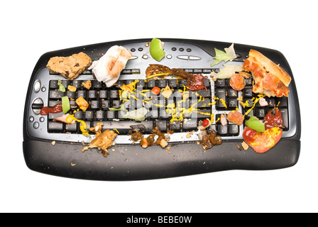 Eine Tastatur mit Lebensmittelreste bedeckt. Stockfoto