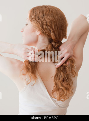 Frau Haar reparieren Stockfoto