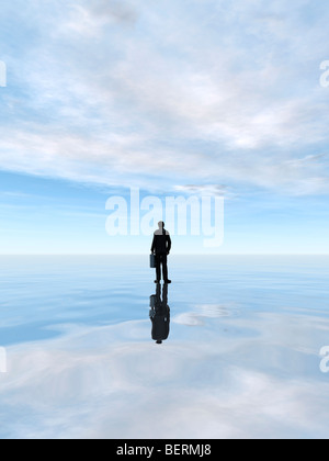 Geschäftsmann, stehend auf dem Wasser Stockfoto