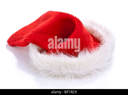 Flauschige rote und weiße Weihnachtsmütze auf weißen Hintergrund isoliert. Stockfoto