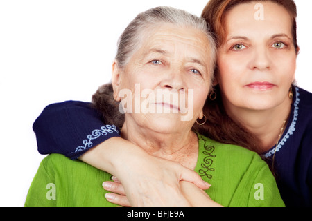 Familienporträt - glückliche Tochter und ihre alte Mutter Stockfoto