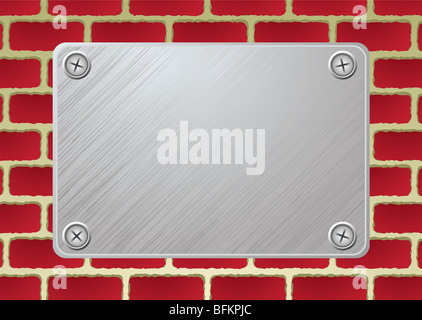 silberne Metallplatte mit Schraube am roten brickwall Stockfoto