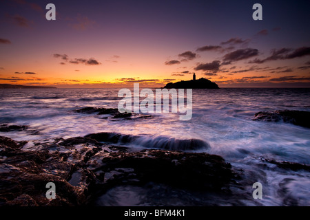 Flut an Sonnenuntergang, Godrevy Point und Leuchtturm, St. Ives Bay, North Cornwall Stockfoto