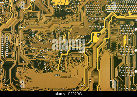 Goldene industrielle Platine elektronische Hintergrund Stockfoto