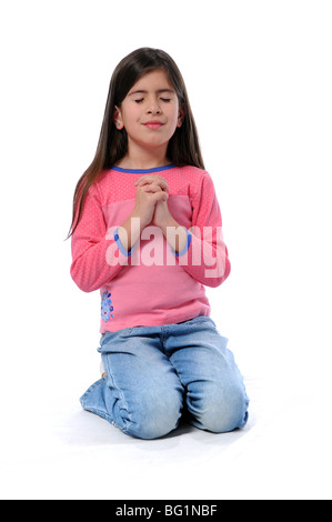 Junges Mädchen mit den Händen umklammert zusammen beten Stockfoto