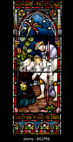 Detail eines Buntglasfensters von Frederick Preedy, das eine der sechs Gnadenakten darstellt, Church of St Andrew, Temple Grafton, Warwickshire Stockfoto