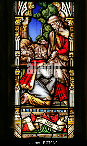 Ein Buntglasfenster von William Warrington, das den Barmherzigen Samariter, die St. Andrew's Church, Field Dalling und Norfolk darstellt Stockfoto