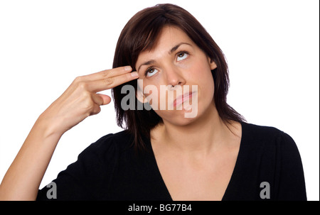 Frau schießen sich in den Kopf mit den Fingern Stockfoto