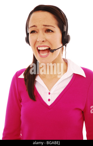Junge Frau, die arbeitet in einem Call-Center unter Druck Stockfoto