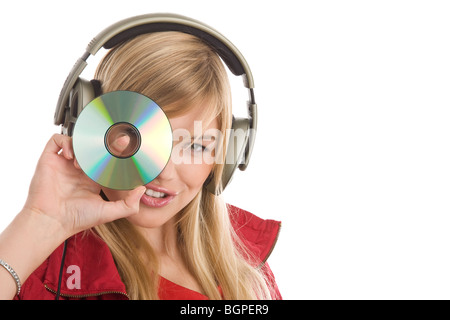 Frau, Musikhören und zeigt CD Stockfoto