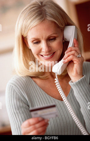 Frau am Telefon Stockfoto