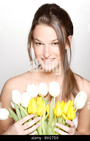 Frau mit Blumen Stockfoto