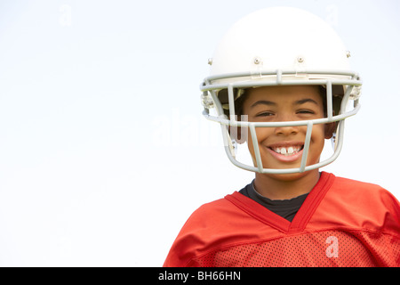 Jungen spielen American Football Stockfoto