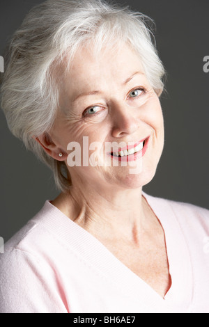 Studioportrait Of Senior Woman Smiling Stockfoto