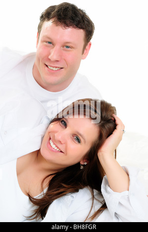 Junges Paar Isolated Over White Stockfoto